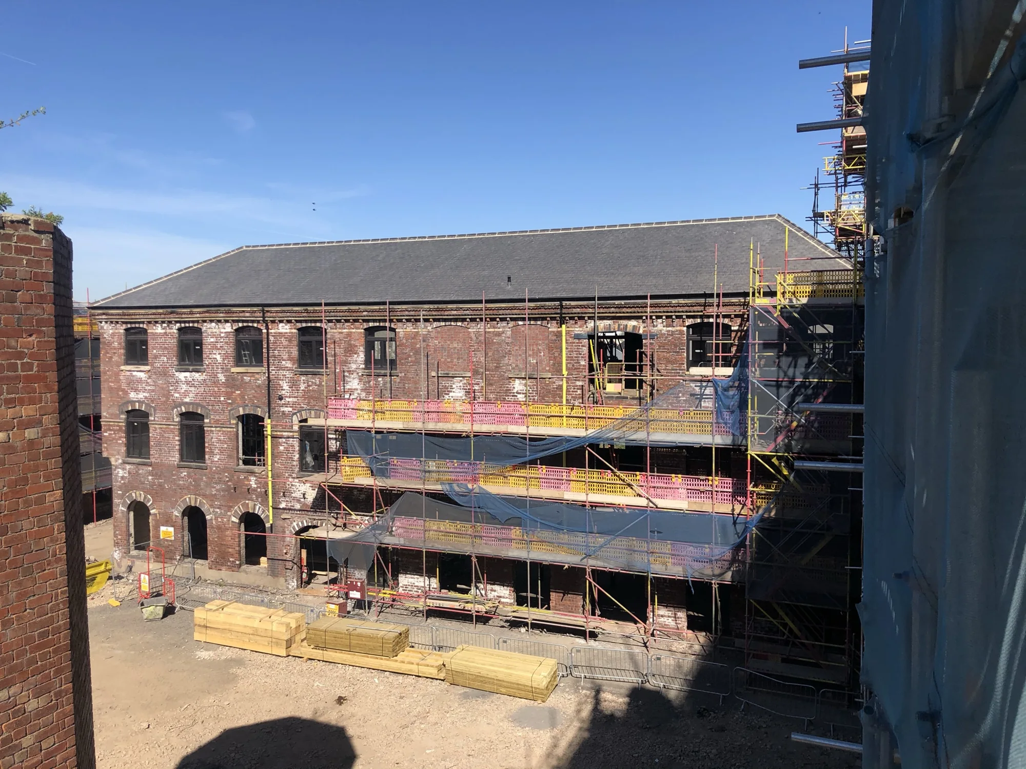 Exterior mill buildings and scaffolding at Rutland Mills during the works