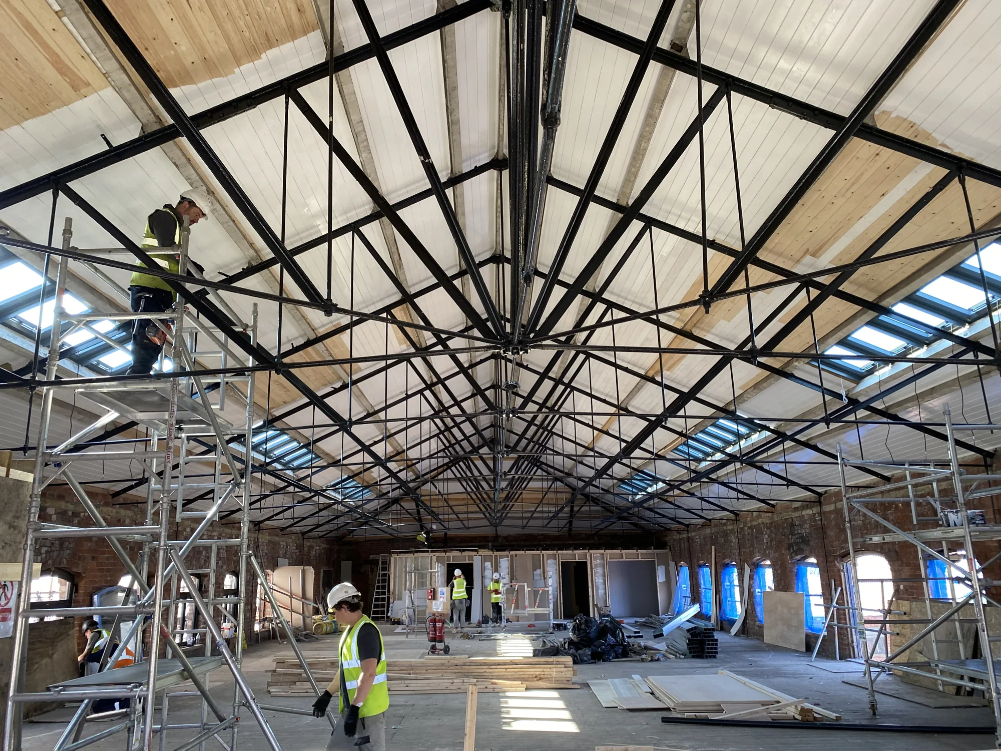 Wide view of the timber-lined roof and retained trusses at Rutland Mills during the works