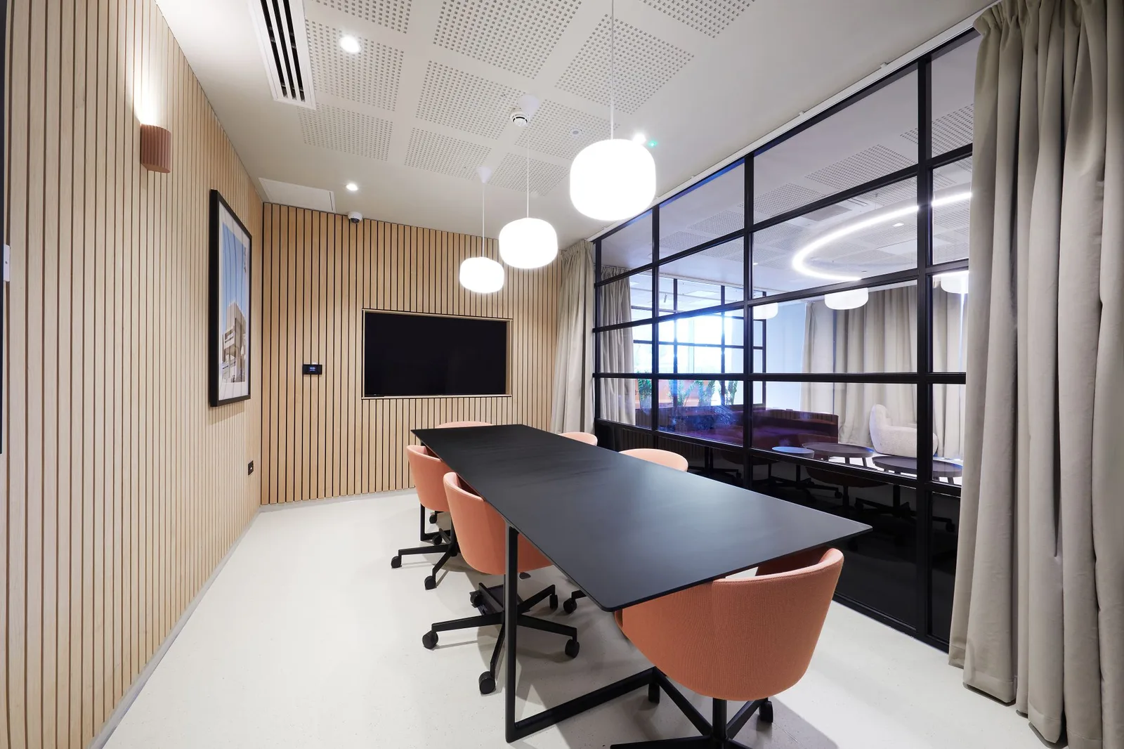 Meeting room with timber wall panelling at North Lodge, London
