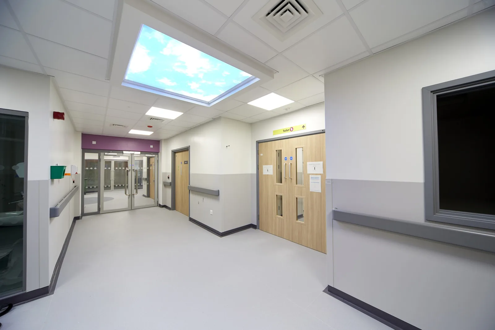 Corridor with timber door sets in the SDEC unit at St James's Hospital, Leeds